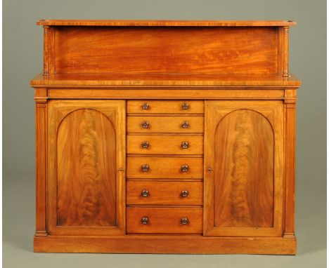 A Victorian mahogany chiffonier, with rear upstand and shelf, the base fitted with a series of short graduated drawers to the