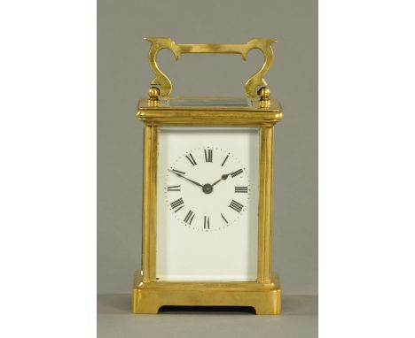 An Edwardian brass carriage clock, timepiece only.  Height excluding carrying handle 11.5 cm.  