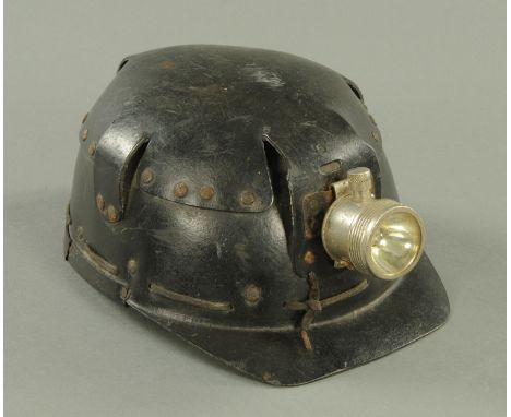 A vintage miners helmet, by Huwood "Light Type Hat".