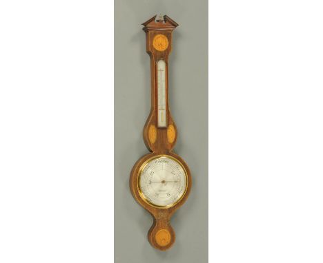 An Edwardian inlaid mahogany aneroid barometer, by A. Franks Ltd., Manchester.  Height 97 cm. 
