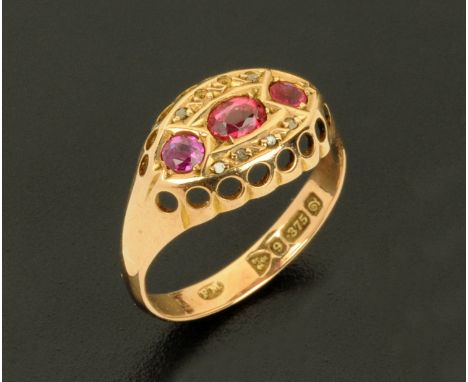 A 9 ct gold three stone ruby ring, Chester hallmarks, size M/N. 