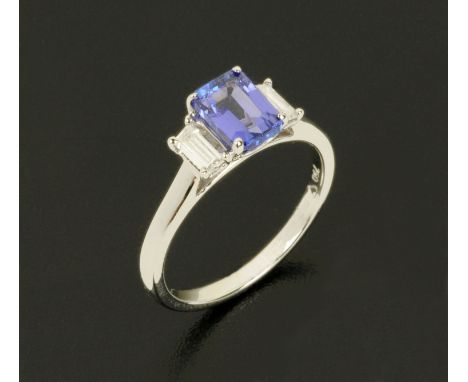 An 18 ct white gold tanzanite and diamond ring, tanzanite 1.13 carats, diamonds .27 carats, size K/L.