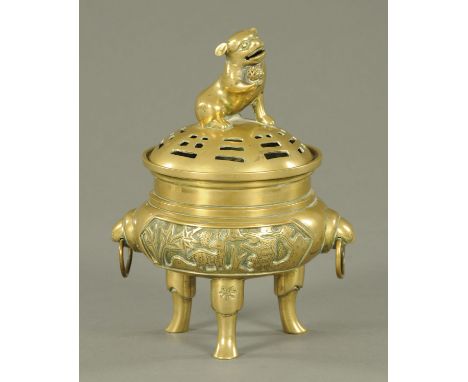 A Chinese brass incense burner and cover, late 19th/20th century, the pierced cover with dog of fo knop above the main body w