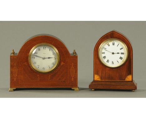 A mahogany mitre top mantle clock, with an enamel dial with Roman numerals, eight day movement, inlaid bats wing decoration a