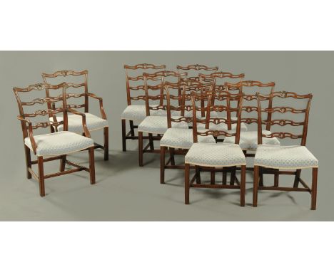 A set of ten George III style mahogany dining chairs, two arm and eight single, each with pierced ladder back, stuffover seat