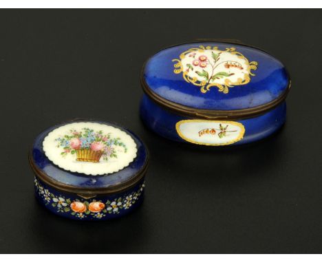 A Bilston enamel patch/snuffbox, circa 1800, oval waisted form, the lid decorated with a basket of flowers against a royal bl