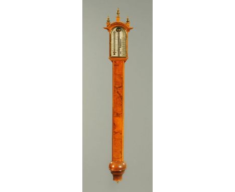 A walnut veneered stick barometer, by Comitti of Holborn, second half 20th century.  Height 103 cm (see illustration). 