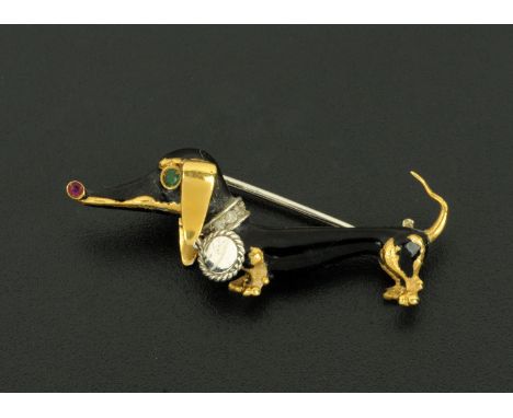 A Rossignoli 18 ct gold gem set brooch, circa 1969, in the form of a dachshund with ruby set nose, emerald set eye and diamon