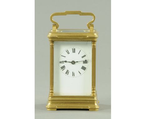 A French brass carriage clock, timepiece only. Height excluding carrying handle 12 cm. 