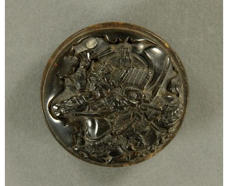 A Japanese pressed horn Manju netsuke, Meiji period, depicting a Samurai on horseback with raised war fan, the reverse with a