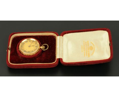 A 14 ct gold cased Continental fob watch, stamped "14 k", knob wind.  Diameter 33 mm. 