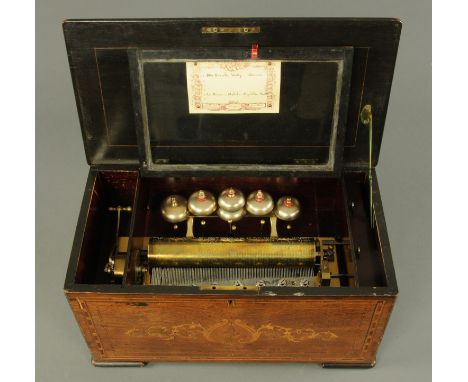 A large late 19th century rosewood and marquetry cased music box, playing six airs, with six bells in sight, the paper label 