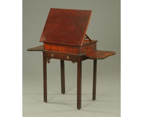 A Georgian mahogany side cabinet, with hinged top, side and front drawer and drop flap to either side and raised on rectangul