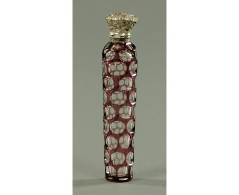 An amethyst overlay glass scent bottle, second half 19th century, with embossed silver coloured metal lid opening to reveal a