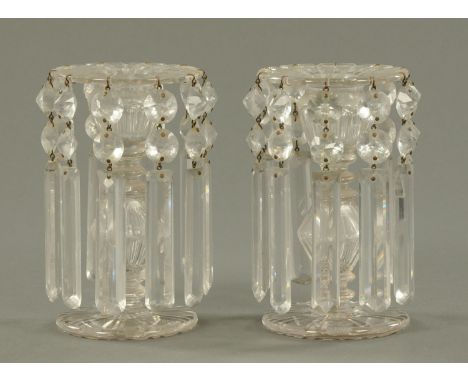 A pair of glass lustres, late 19th century, with fine etched decoration to the top above the hollow knopped body.  Height 16.