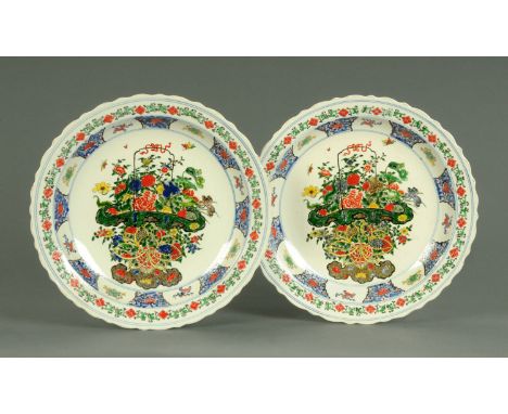 A pair of Chinese Famille Verte chargers, post Republic period, enamelled with flowering baskets and shou and with wavy rim, 