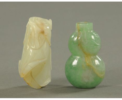 Two jade snuff bottles, 19th/20th century, one carved as a group of enclosed leaves, the other as a double gourd carved on a 