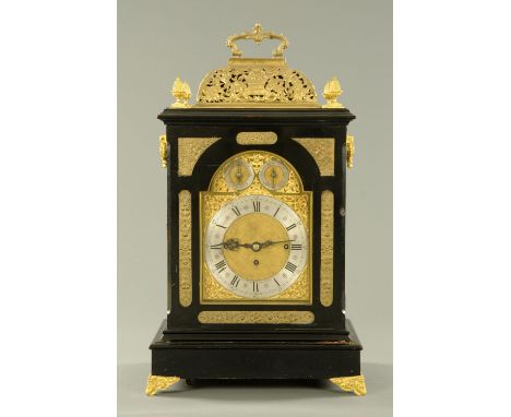 A large triple fusee ebonised bracket clock, with silvered brass dial and striking and chiming on eight bells and a gong. Wid