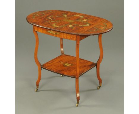 A 19th century painted satinwood twin drop flap table, with low shelf and shaped legs all raised on brass castors.  Width 61 