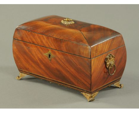 A Regency mahogany tea caddy, of bombe form, with brass fittings and bracket feet.  Width 31 cm (see illustration). 