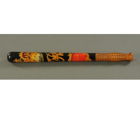 A Victorian painted wood police truncheon, polychrome decorated with crowned cipher above a cartouche inscribed "Police", wit