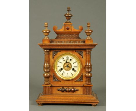 A late 19th century mantle clock, with two-train spring driven movement, in walnut case.  Height 48 cm, width 30 cm. 