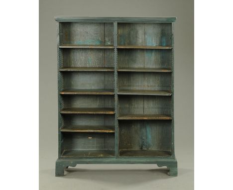 A painted open bookcase, blue, with adjustable shelves and all raised on bracket feet.  Width 120 cm. 