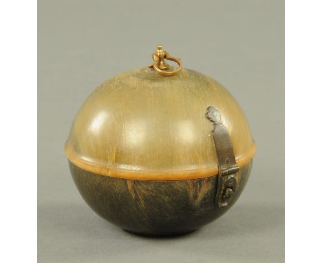 A Georgian horn tea caddy, globular form.  Diameter 9.2 cm (see illustration).    CONDITION REPORT:  In general this appears 