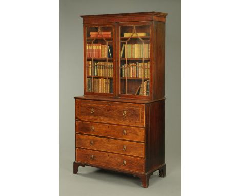 A Regency rosewood secretaire bookcase, with moulded cornice above a pair of glazed doors, the base fitted with a secretaire 