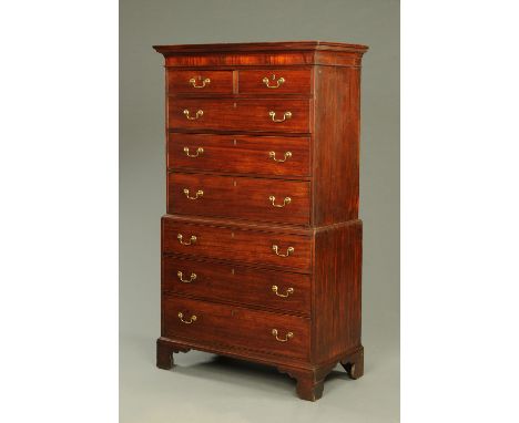 A George III mahogany chest on chest, with moulded cornice above two short and three long drawers to the upper section and th