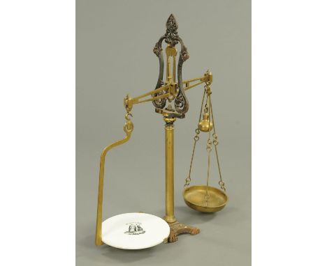 A large set of Victorian brass and iron shop scales.  Height 99 cm (see illustration). 