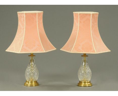 A pair of glass light shades, baluster form, with brass bases and pink shades.  Height including shade 58 cm.   CONDITION REP