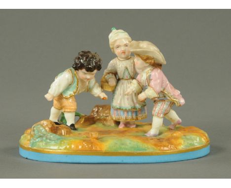 A Meissen style figure group, children playing, crossed swords mark to base.  Length 18 cm. 