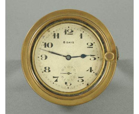 A vintage Swiss made car clock, eight day, with Arabic numerals, subsidiary seconds dial and brass bezel.  Diameter 97 mm (se