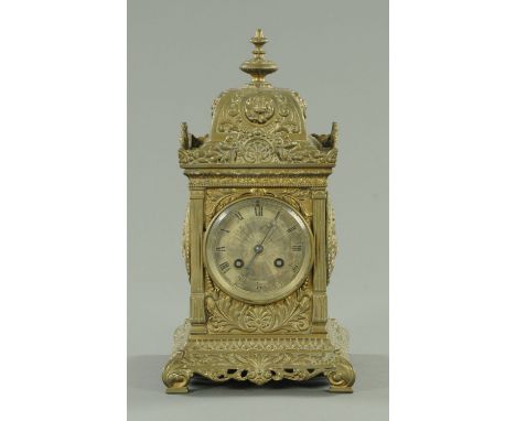 A Victorian brass cased mantle clock, with two-train movement striking on a gong.  Height 31 cm. 