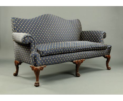 A Chippendale style settee, early 20th century, upholstered in blue and gold star patterned material and raised on shell and 