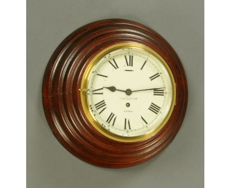 A mahogany cased bulkhead clock, the dial marked "Astral, Coventry" and in a stepped mahogany surround, the rear of the case 