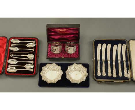 A collection of silver, to include a pair of pierced napkin rings, William Hutton & Son, London 1894, pair of silver bonbon d