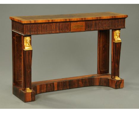 A Regency style rosewood console table, with guilloche frieze and caryatid supports.  Width 132 cm (see illustration). 