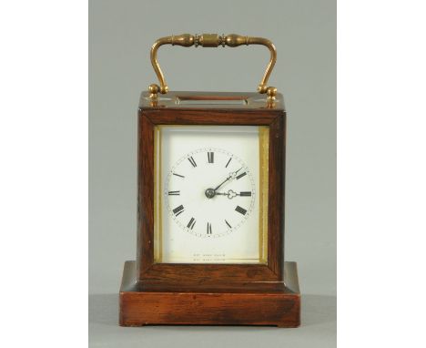 A 19th century rosewood cased carriage clock, the enamelled dial marked "Henry Marc Paris", two-train movement striking on a 