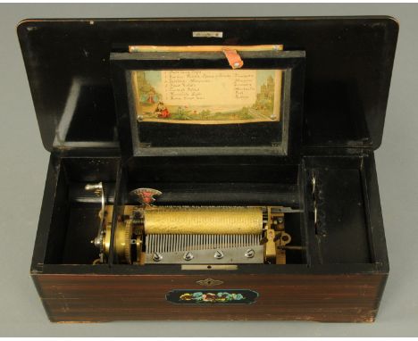 A late 19th century Swiss musical box, simulated rosewood, playing eight airs, paper label.  15.5 cm cylinder, case width 46 