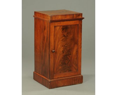 A mahogany pedestal cupboard, with caddy top above a single door opening to a shelf and drawers.  Width 49.5 cm. 