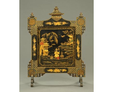 An Edwardian black lacquered Chinoiserie fire screen.  Width 86 cm (see illustration).    CONDITION REPORT:  The screen is co