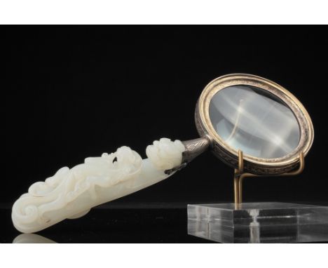 Age: Middle Qing Dynasty   Description: An exceptionally fine white jade belt hook carved to depict two confronting dragons t