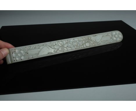 Date: Qing dynasty  A fine and large white jade page-turner carved with pierced work to form birds and floral motifs. The who