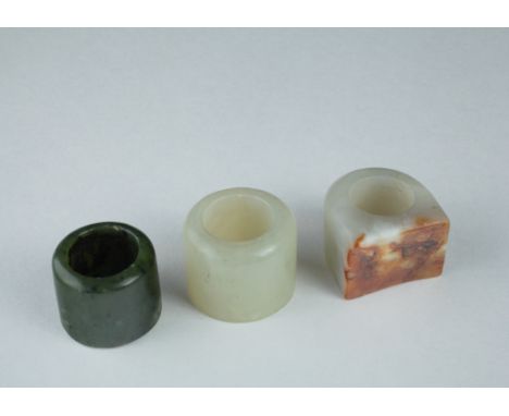 Age: Probably Qing Dynasty  Description: A lot of three jade and hardstone thumb rings. Two round in form with typical concav