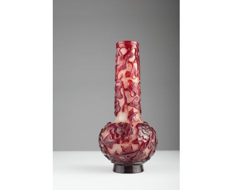 Age: Mid-Qing dynasty Description: A Chinese Beijing / Peking glass ruby colour carved overlay on snowflake ground vase, the 