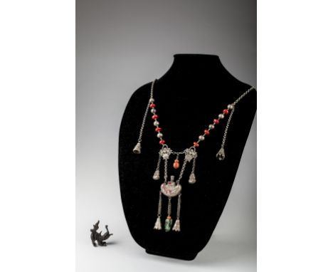Age: Qing dynasty, 19th century   Description: An impressive Chinese silver torque-shaped necklace with central repousse holl
