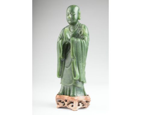 Age: Qing Dynasty    Description: A large standing figure of Buddha, wearing a flowing robe draped over the shoulder, hands o