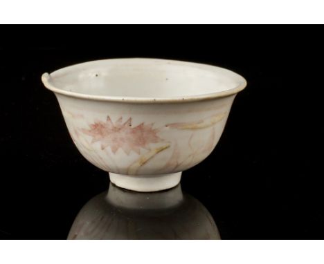 Age: Probably Ming dynasty  Description: A Chinese porcelain teacup with underglaze red design of lotus to the outside, all a